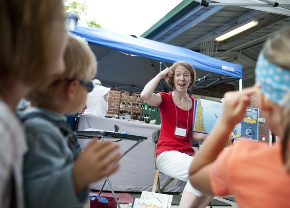 Deborah Diesen, author of The Pout Pout Fish series, reads one of her books with hand gestures to an audience at the Kerrytown BookFest Sunday. Diesen started the series in 2008. Daniel Brenner I AnnArbor.com